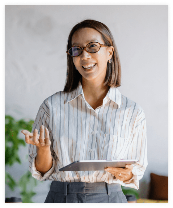 Benefits consultant talking with a client while holding a tablet